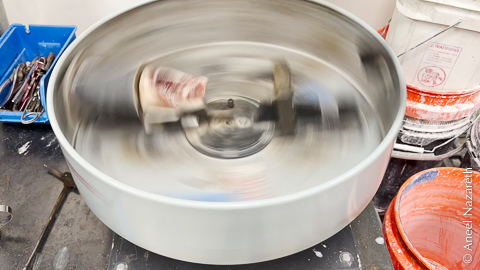 An open centrifuge spins. You can see the flask on one side of the image
